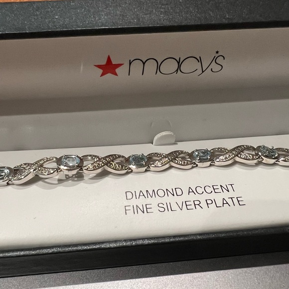 Silver Blue Topaz Infinity Bracelet - Picture 1 of 6